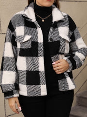 Textured plaid shacket with fluffy collar in black and white, featuring button closure and chest pockets.