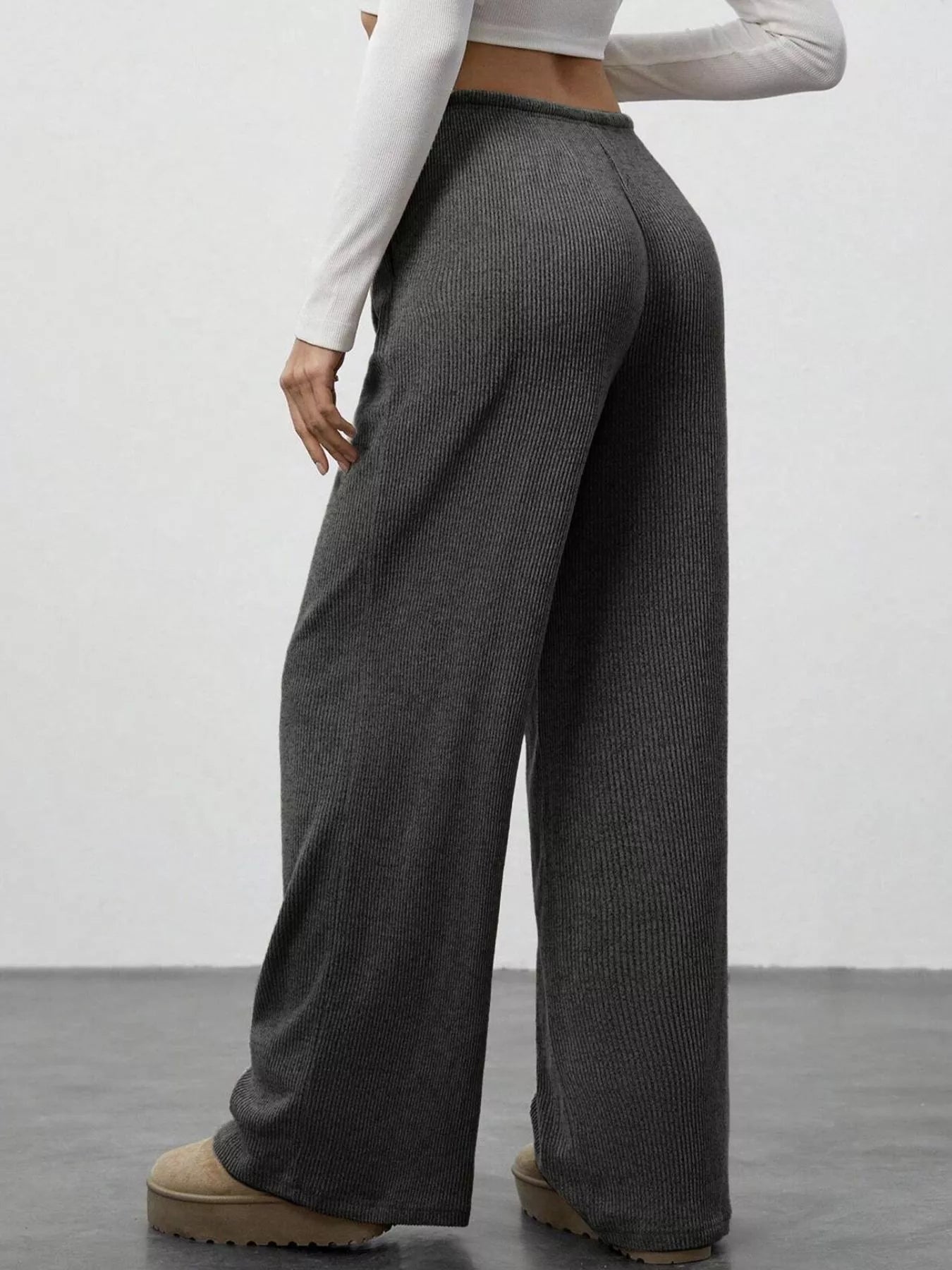 Dark gray ribbed wide-leg pants with drawstring detail