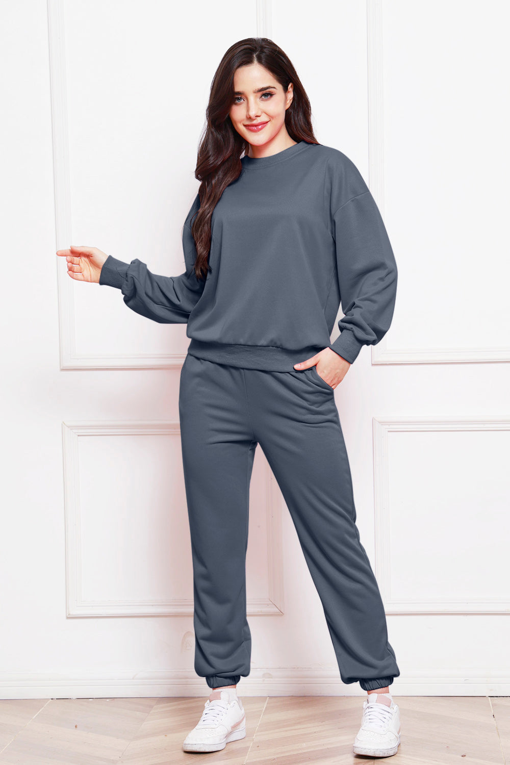 Relaxed fit dark gray loungewear set with crewneck sweatshirt and jogger pants.