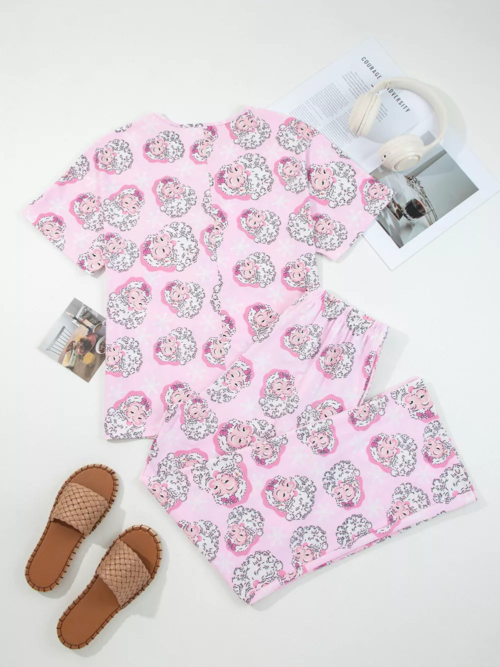 Pink V-neck pajama set with sheep print, short sleeves, and drawstring shorts.