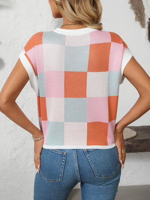 Checkerboard knit cap sleeve top in pink, orange, blue, and white pastel checkerboard pattern.