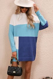 Geometric colorblock knit mini dress in white, light blue, and navy blue with a mock neck and long sleeves.