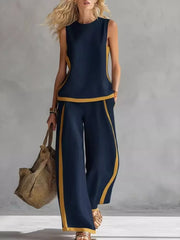 Navy blue sleeveless tank and wide-leg pants set with yellow trim.