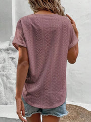 Eyelet V-neck tunic top in pink purple with short sleeves and a textured pattern.