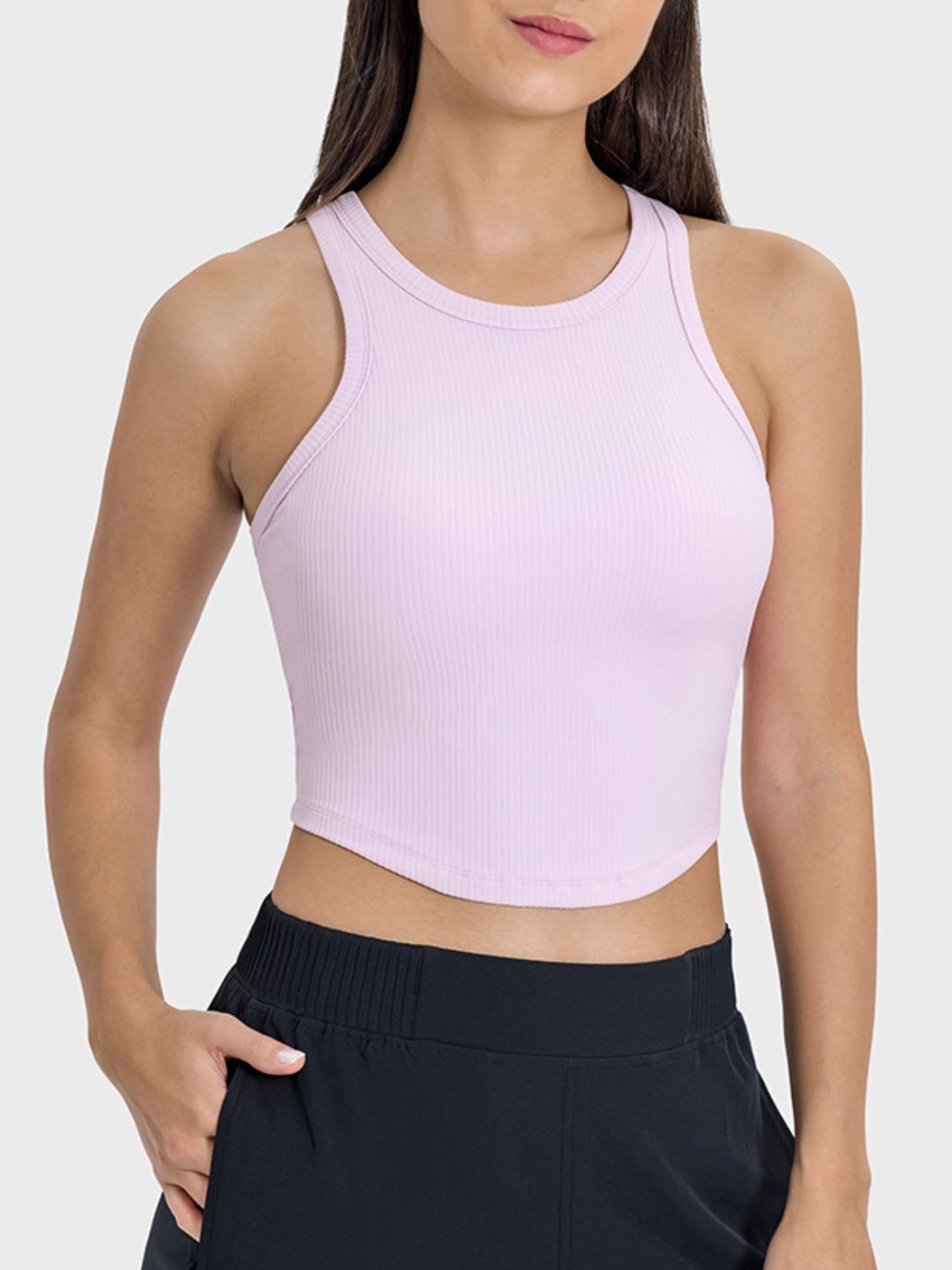 Blush pink ribbed racerback active tank top with round neckline.