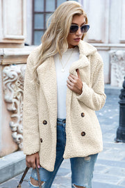 Cream teddy pea coat with double-breasted closure and notched lapels.