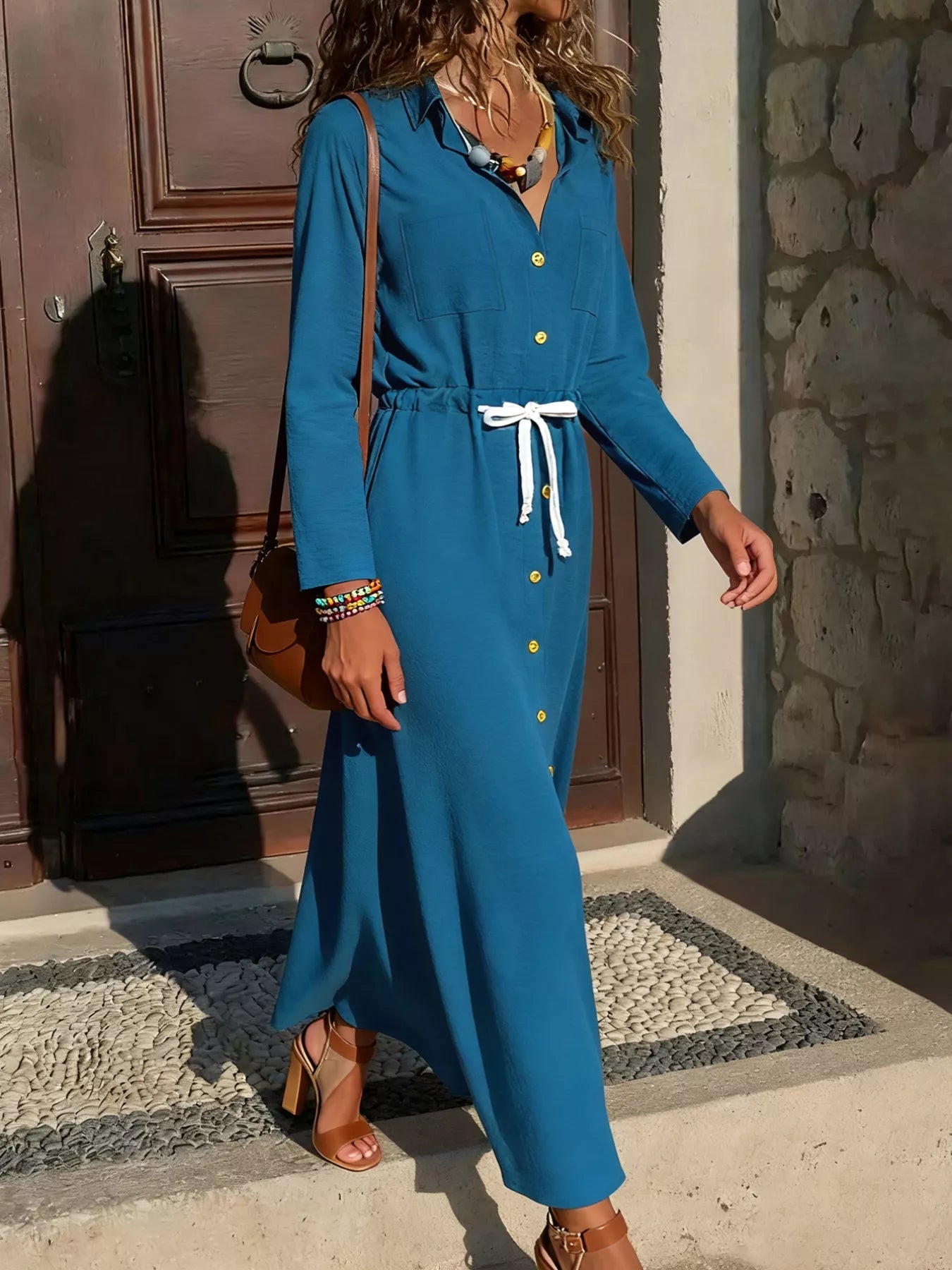 Button-down maxi dress in French Blue with drawstring waist and long sleeves.