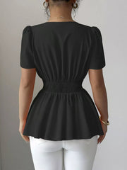 Black peplum blouse with smocked waist and puff sleeves