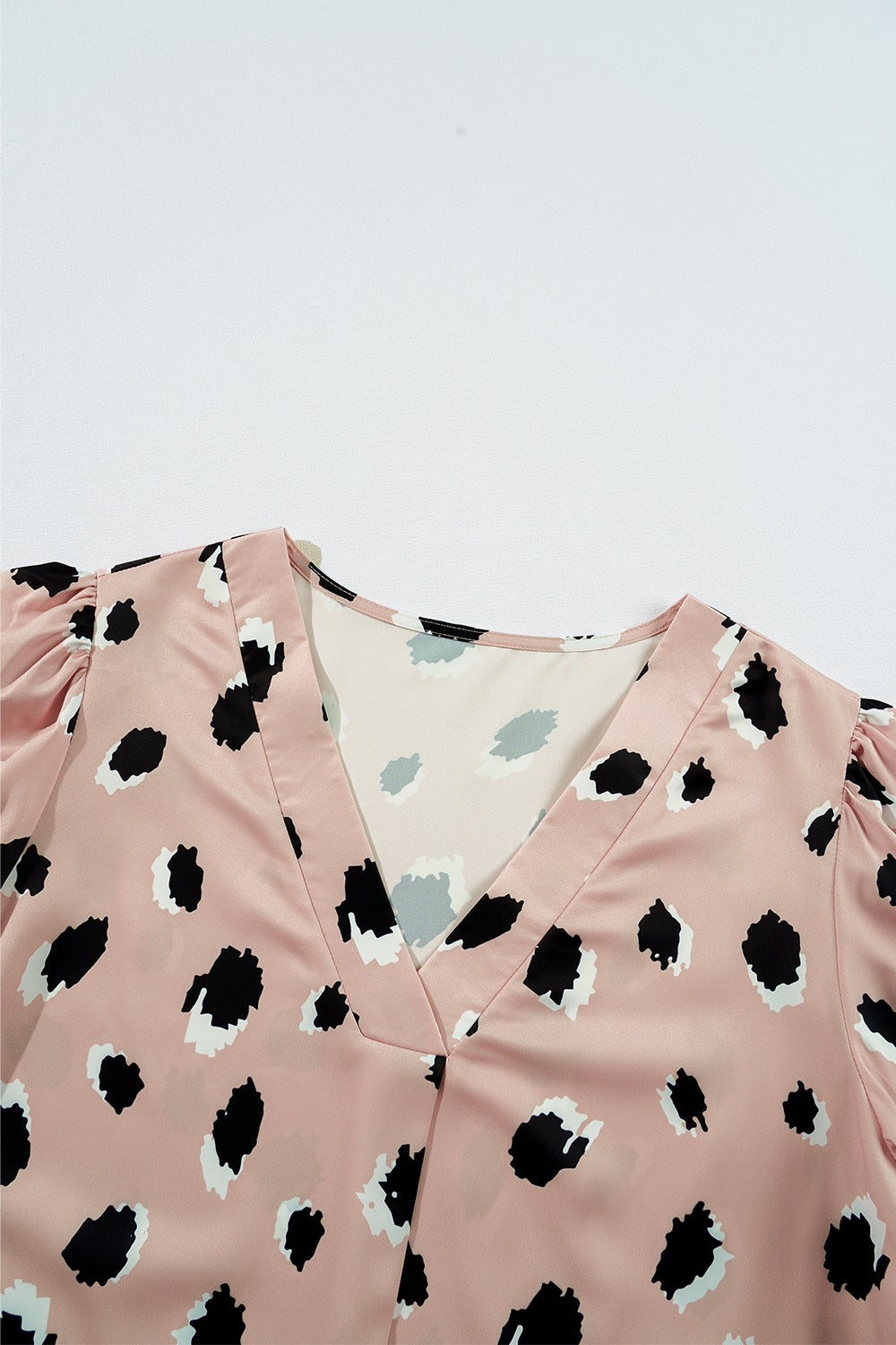 Dust Storm silk blouse with blouson sleeves and a spot print.