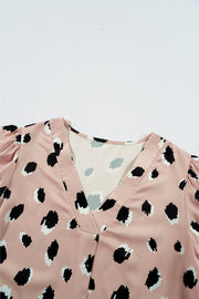 Dust Storm silk blouse with blouson sleeves and a spot print.
