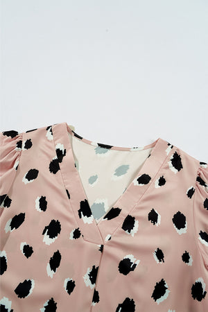 Dust Storm silk blouse with blouson sleeves and a spot print.