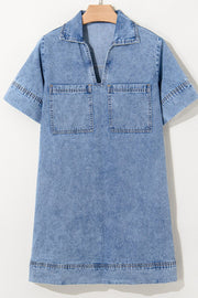 Light blue denim mini dress with collar, V-neck, short sleeves, and two chest pockets.