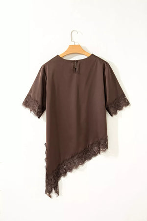 Brown satin maternity blouse with asymmetric hem and lace trim details.