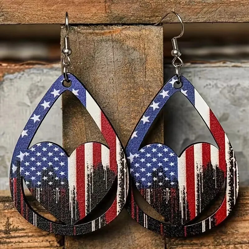 Patriotic teardrop heart earrings with American flag design and star accents.