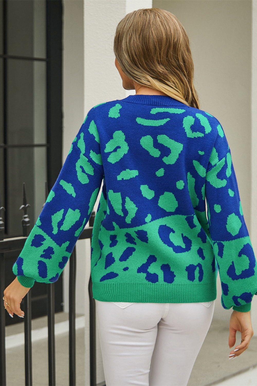 Colorblock leopard knit sweater with balloon sleeves in blue and green acrylic.
