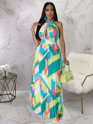 Halter neck maxi dress with geometric print and pleats, defined waistband, and cutout detail.