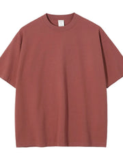 Oversized crewneck tee in rust, relaxed fit, short sleeves, basic casual style.