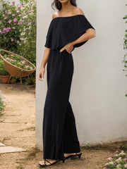 Black off-the-shoulder flounce jumpsuit with wide legs
