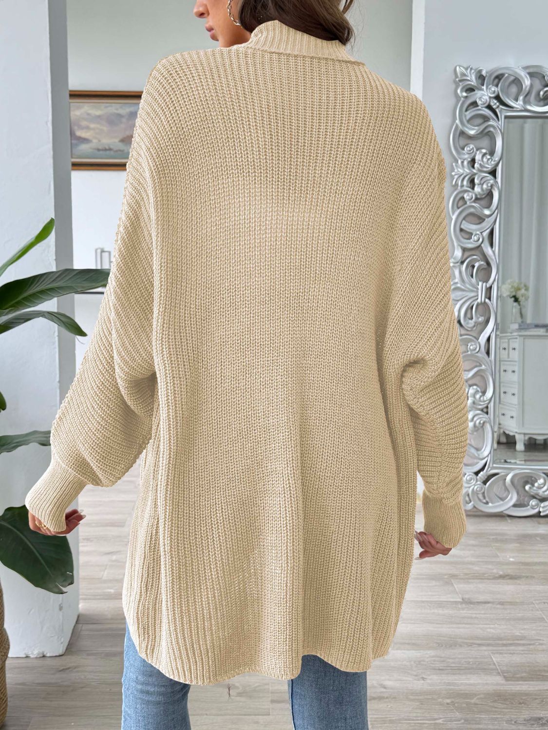 Pearl button ribbed knit cardigan in tan, featuring a relaxed fit and long sleeves.