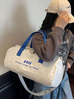 Off-white sporty duffel bag with blue graphic logo and straps, adjustable strap.