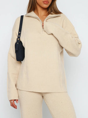 Tan ribbed knit quarter-zip lounge set with a relaxed fit and silver zipper detail.