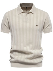 Beige textured ribbed knit polo shirt with vertical stripes and short sleeves.