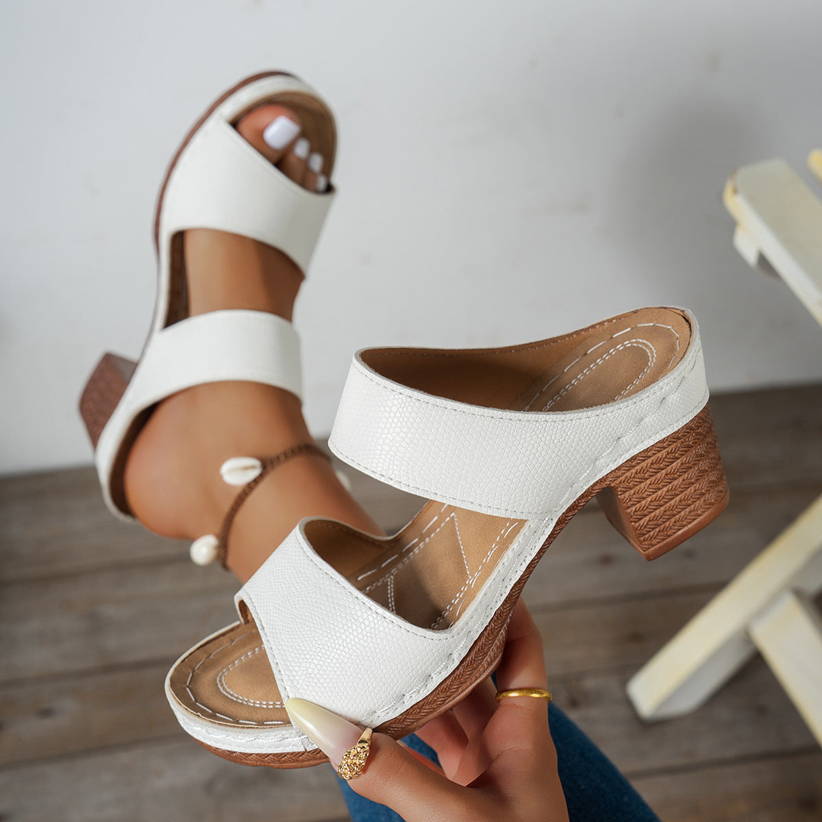 White textured strap block heel sandals with woven heel detail.