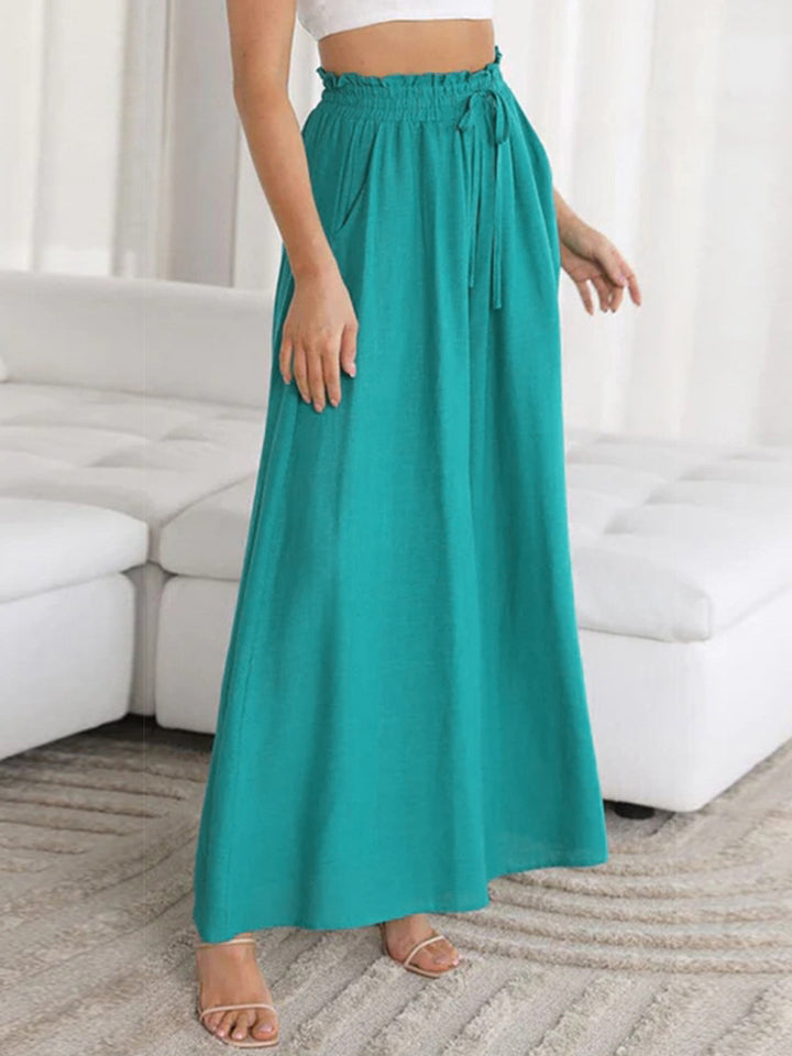 Teal gathered waist palazzo pants with drawstring and pockets, 100% polyurethane.