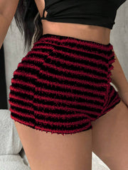 Textured stripe bouclé shorts in black and burgundy with a frayed hem.