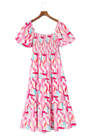 Blush pink midi dress with smocked bodice, puff sleeves, and tiered skirt in a brushstroke print.