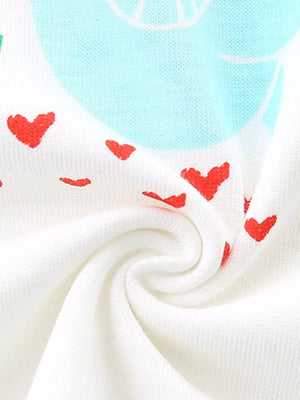 White cotton tee with red hearts and blue graphic detail.