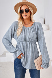 Light blue long sleeve blouse with gathered neckline and elastic waist, ruffled cuffs