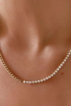 Gold curb chain necklace with half zirconia detail