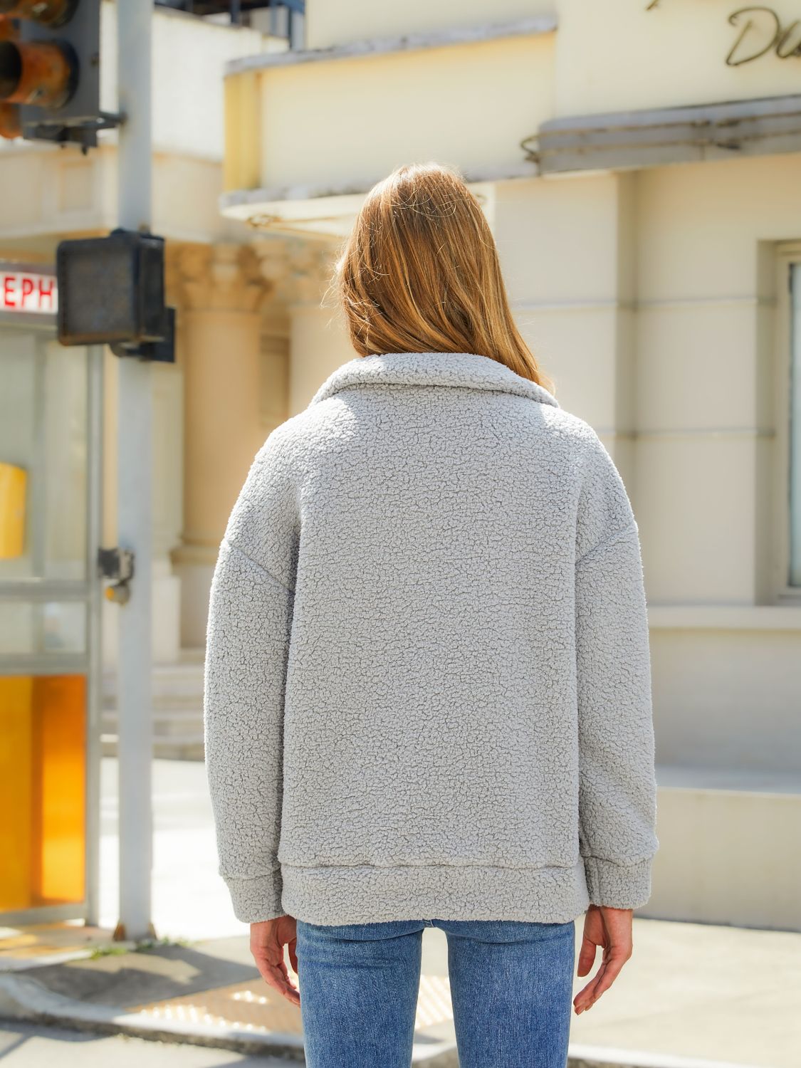 Charcoal sherpa zip jacket with quilted panels and a collar, shown from the back.