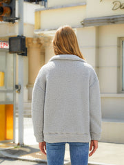 Charcoal sherpa zip jacket with quilted panels and a collar, shown from the back.
