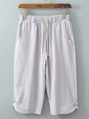 Light grey cropped sweatpants with drawstring and side pockets.