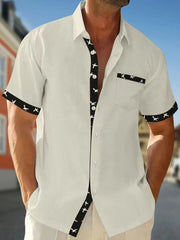 White waffle weave short sleeve shirt with airplane print contrast trim and pocket.