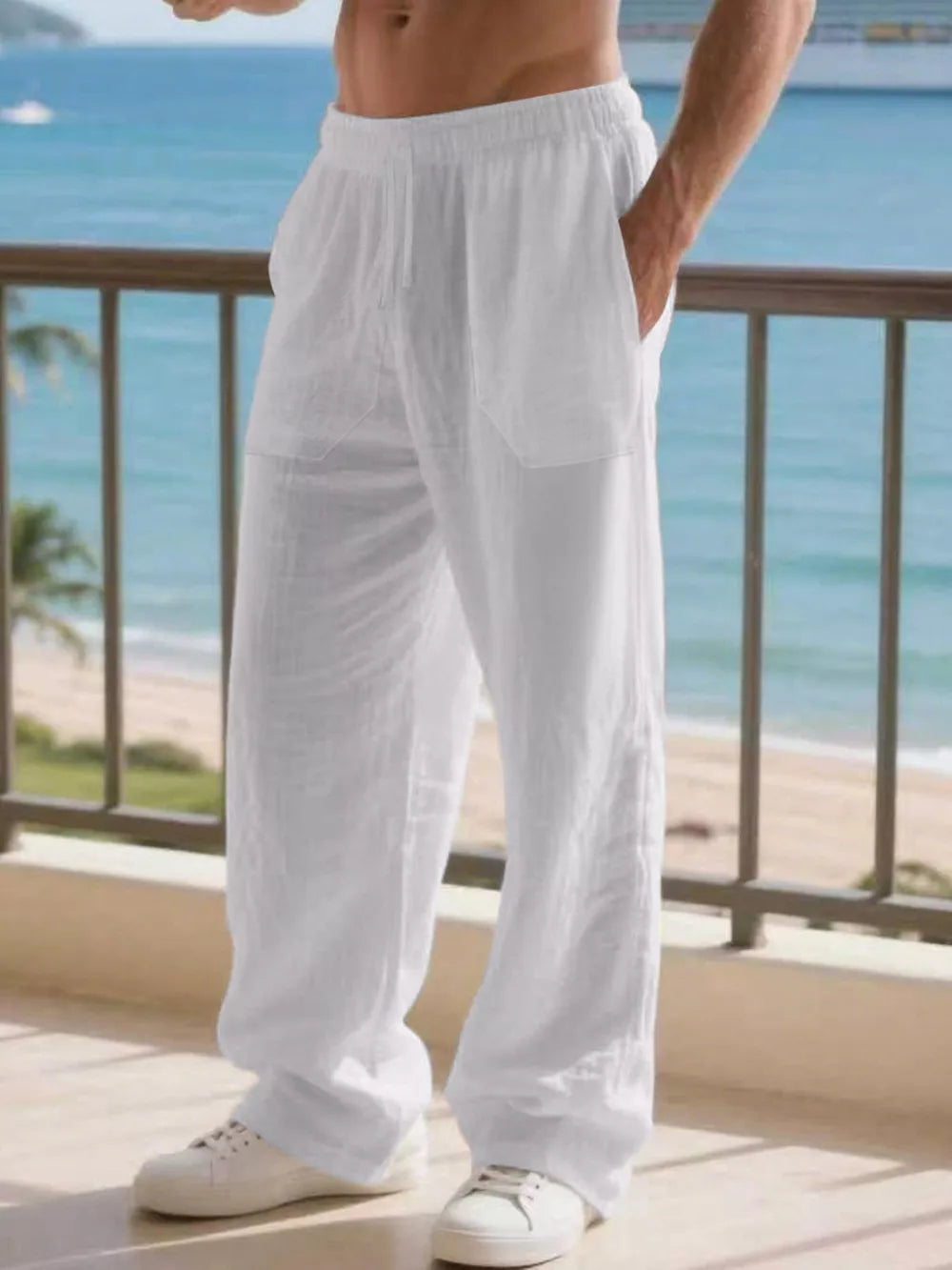 Men's white linen drawstring joggers with side pockets, relaxed fit.
