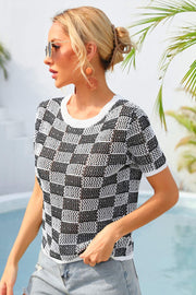 Checkerboard knit crewneck top in black and white with short sleeves and a relaxed fit.