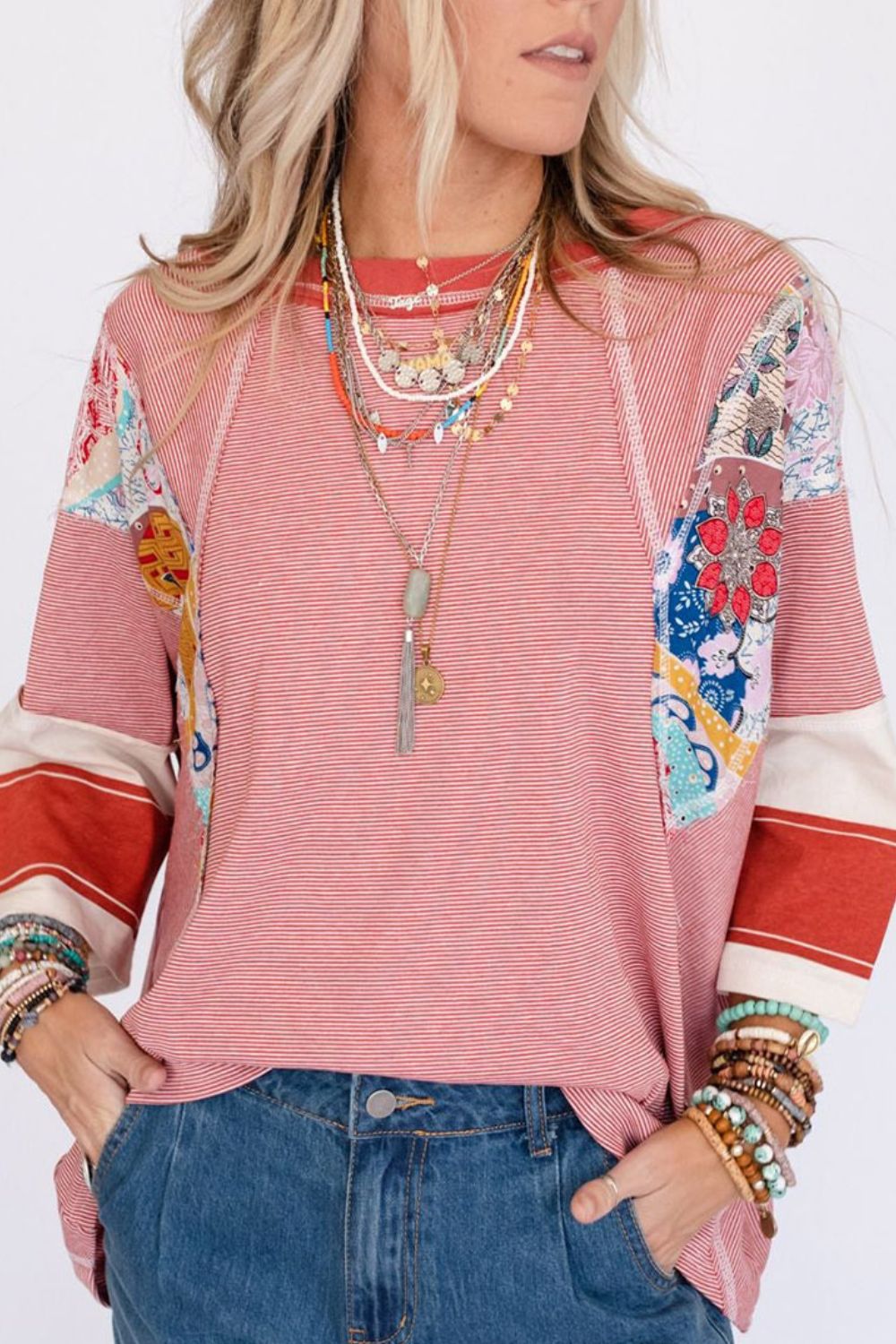 Patchwork stripe raglan sleeve tee in deep red with colorful boho patchwork details.