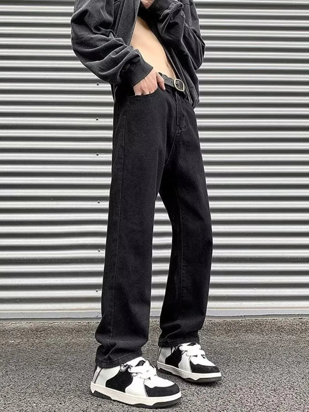Men's black wide-leg jeans with a washed finish and casual styling.