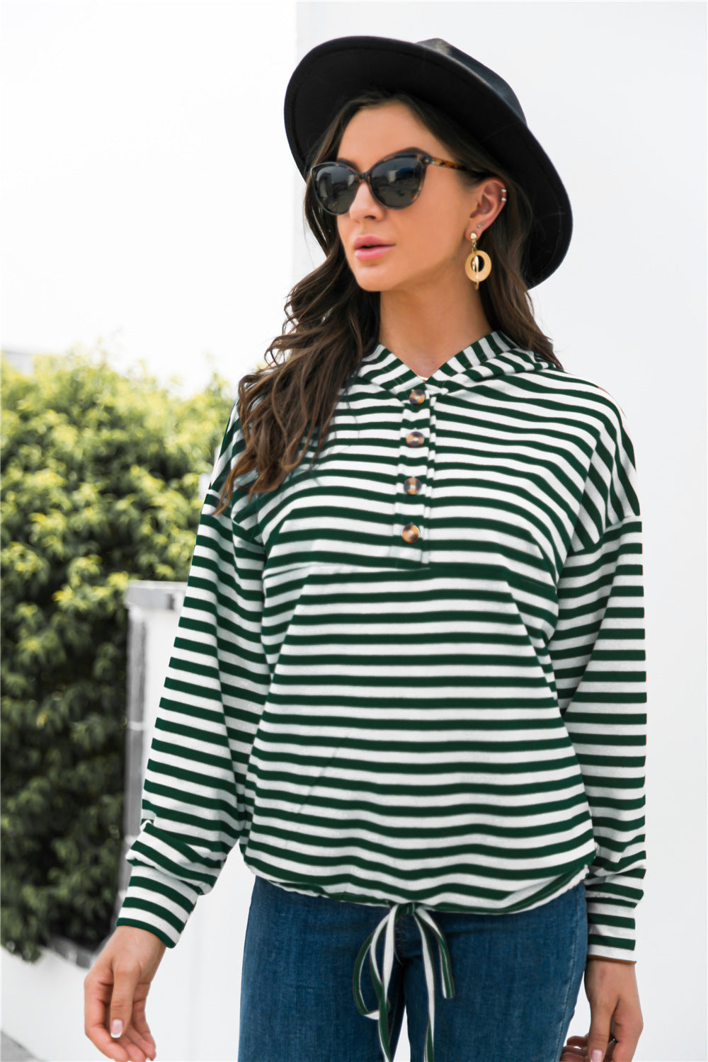 Green and white striped hoodie with button neck and drawstring waist