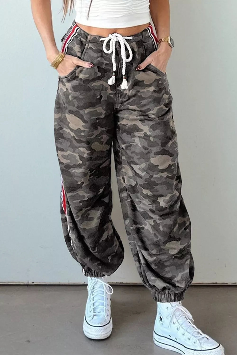 Camo print relaxed fit maternity pants with drawstring and side stripe detail.