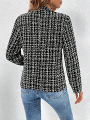 Black and white textured tweed blazer with a plaid pattern, open front, and long sleeves.
