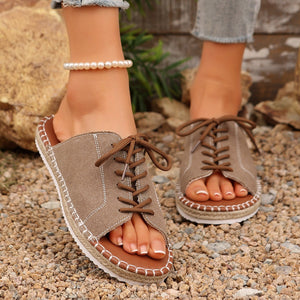 Khaki lace-up open-toe flats with espadrille trim and brown laces.