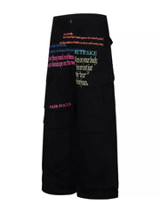 Black cargo pants with colorful text print and multiple pockets.