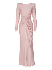 Pink ruched knot front maxi dress with long sleeves and a draped neckline.