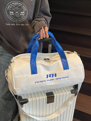 Off-white duffel bag with blue handles and "PERPETUAL MOTION" graphic, pu leather.