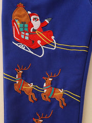 Dark navy baby pants with embroidered Santa in a sleigh and reindeer Christmas design.