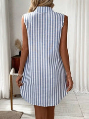 Sleeveless collared shirt dress in light blue and white vertical stripes, above the knee length.
